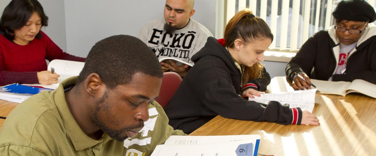 Diverse group of students in classroom studying